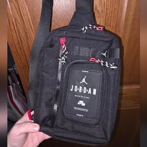 Jordan Black Sling Bag with Red Accent Zippers